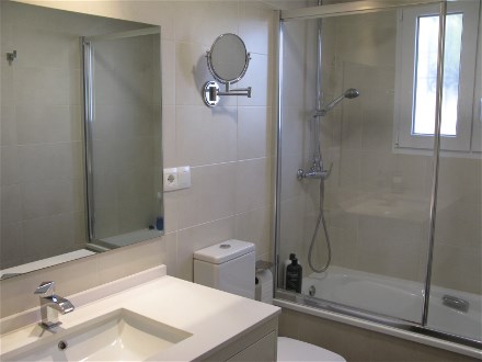 This bright bathroom in the first floor has a bath tub