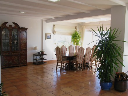 in the open salon you find this large dining table with views to the sea