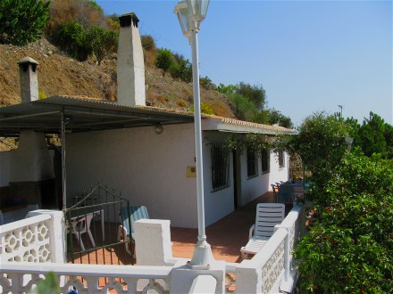 Between the pool and the house you have another terrace with barbecue corner.