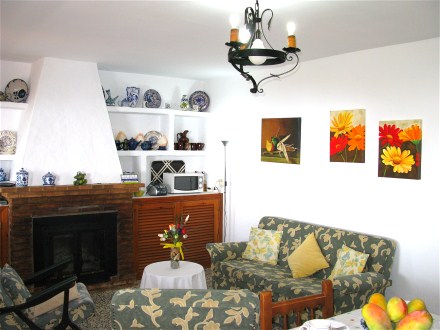 The living room has a chimney and heating for cold winner days